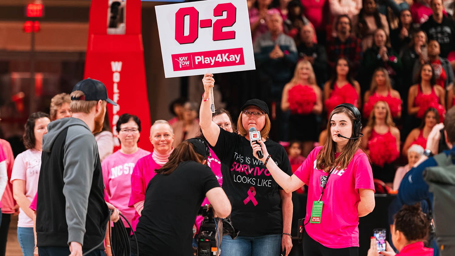 D'Lyn Ford, a staffer with NC State's College of Agriculture and Life Sciences, speaks on behalf of fellow breast cancer survivors at the annual Play4Kay game.