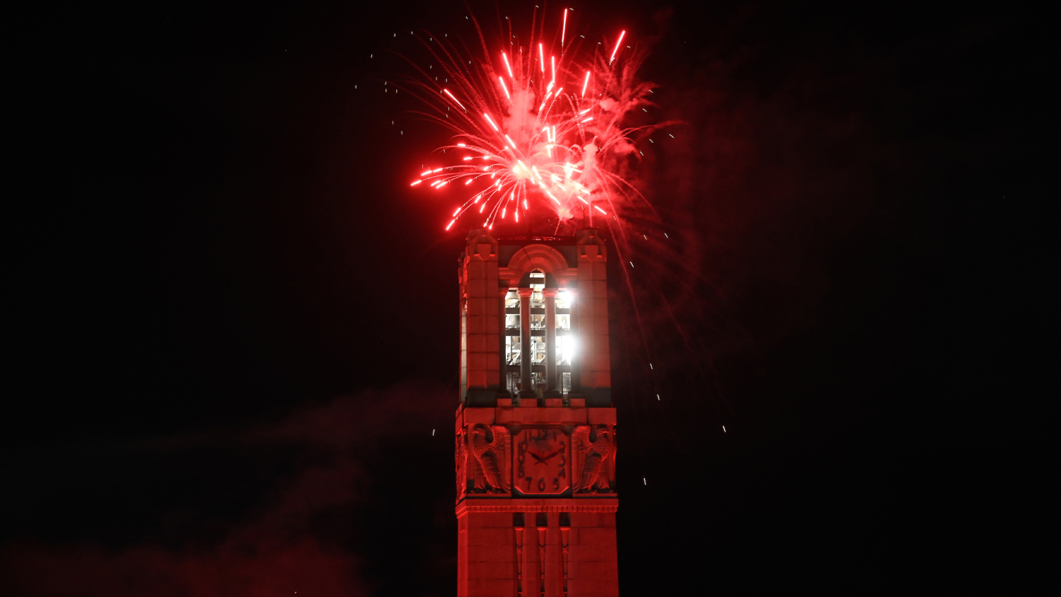 Fireworks explode over the NC State belltower to close down Packapalooza 2022. Photo by Marc Hall