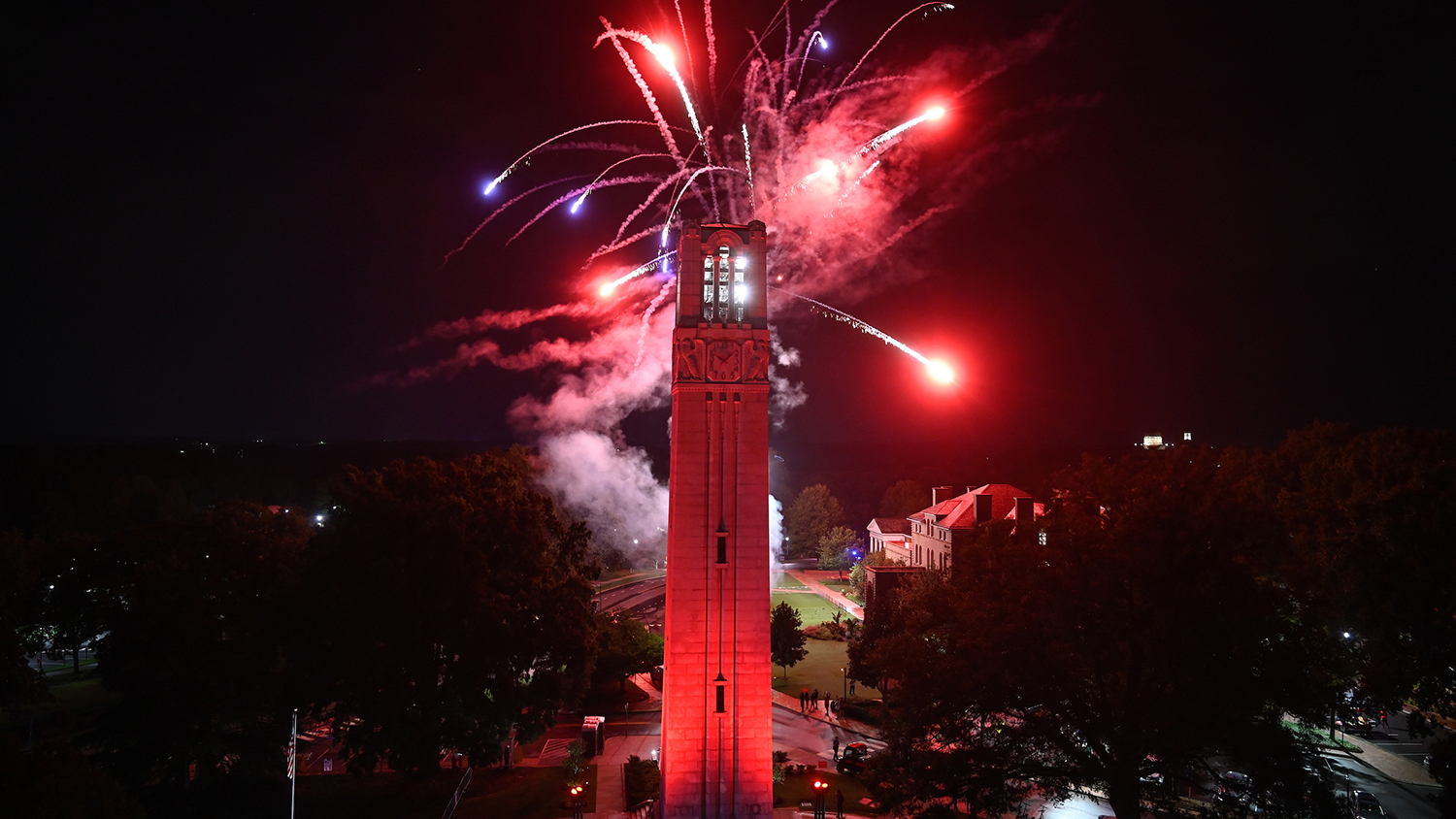 Fireworks explode over the NC State belltower to close down Packapalooza 2022. Photo by Marc Hall