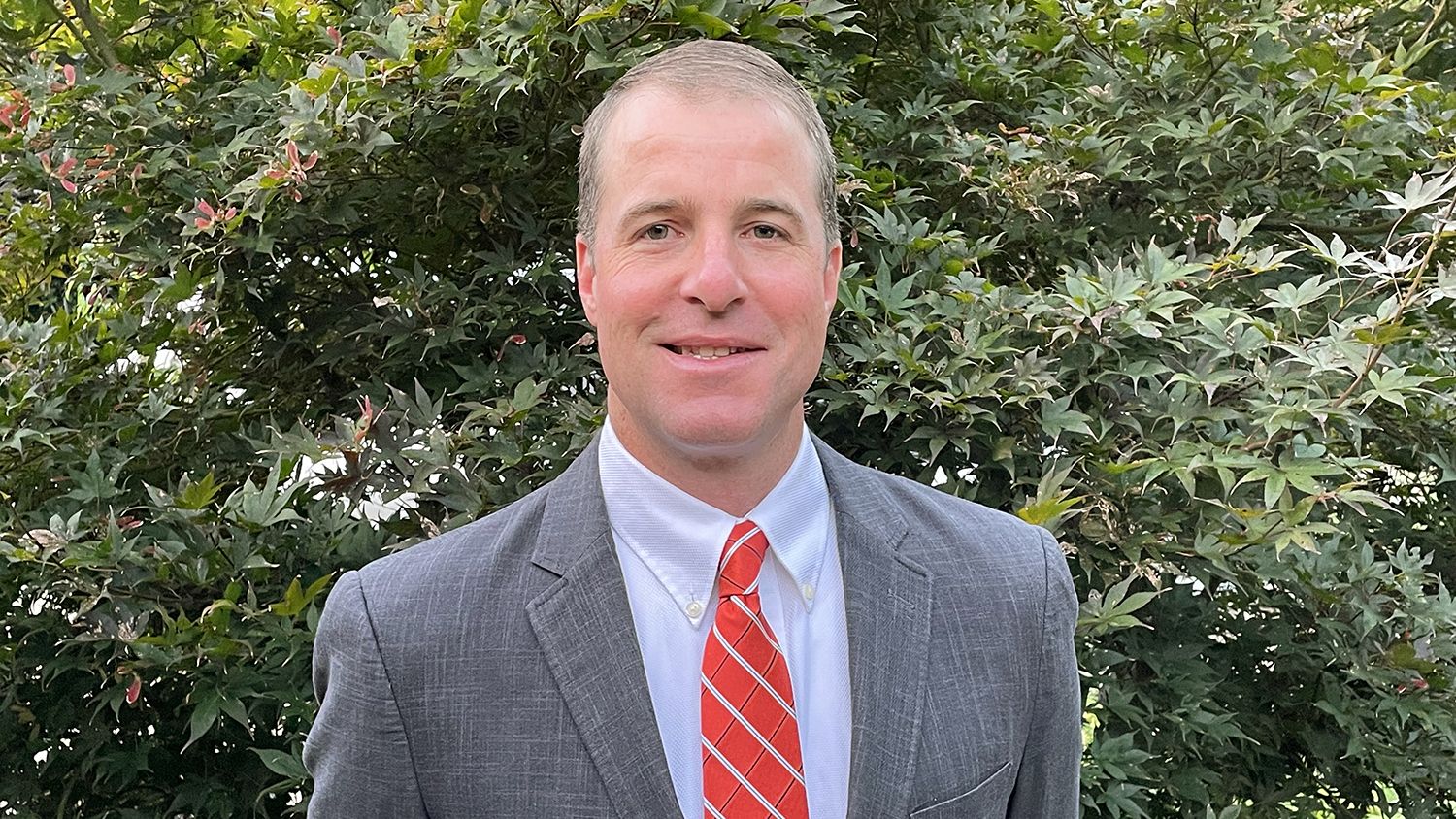 Lee Ivy with a tree backdrop