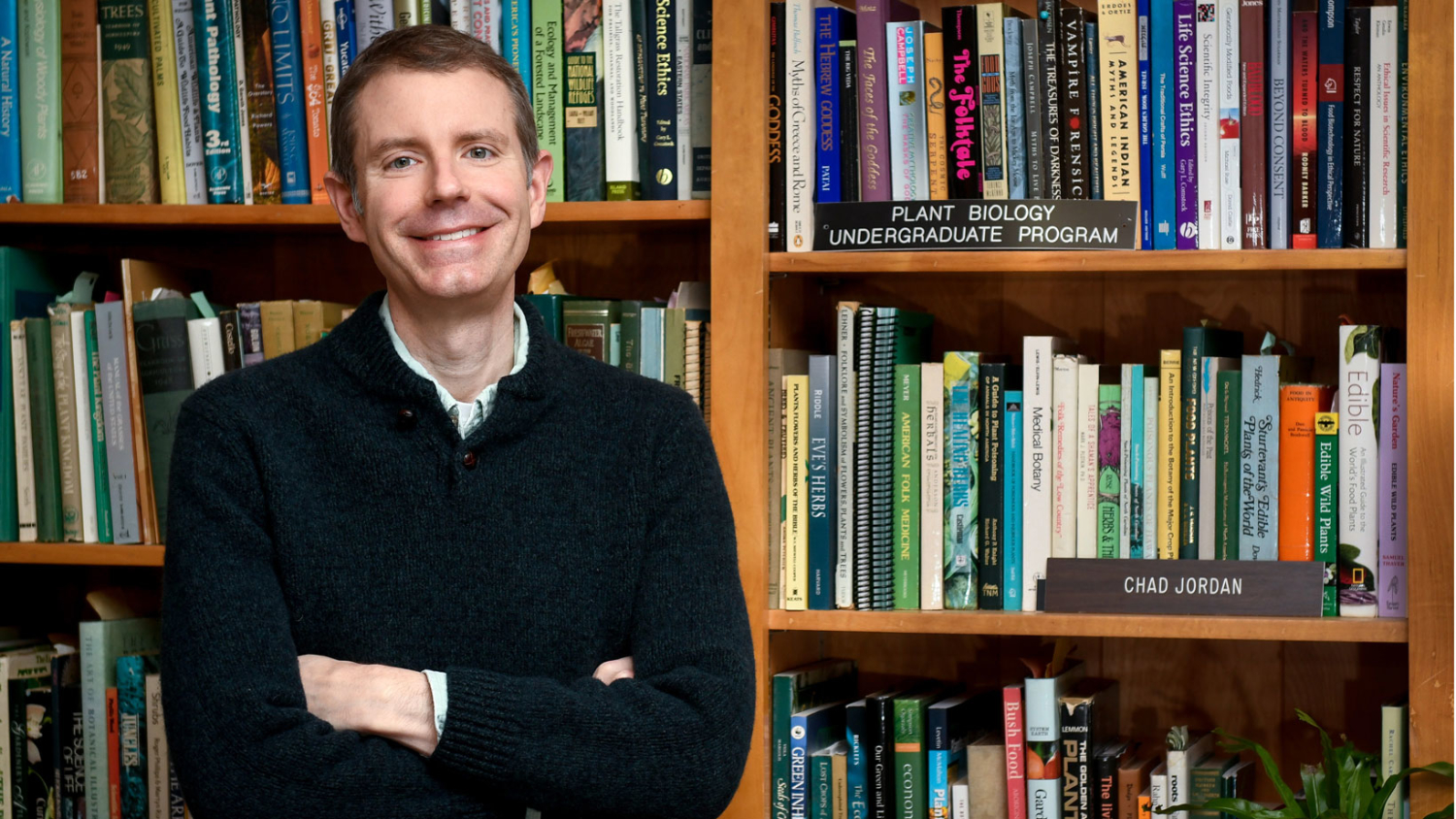 Picture of Chad Jordan in front of a bookcase