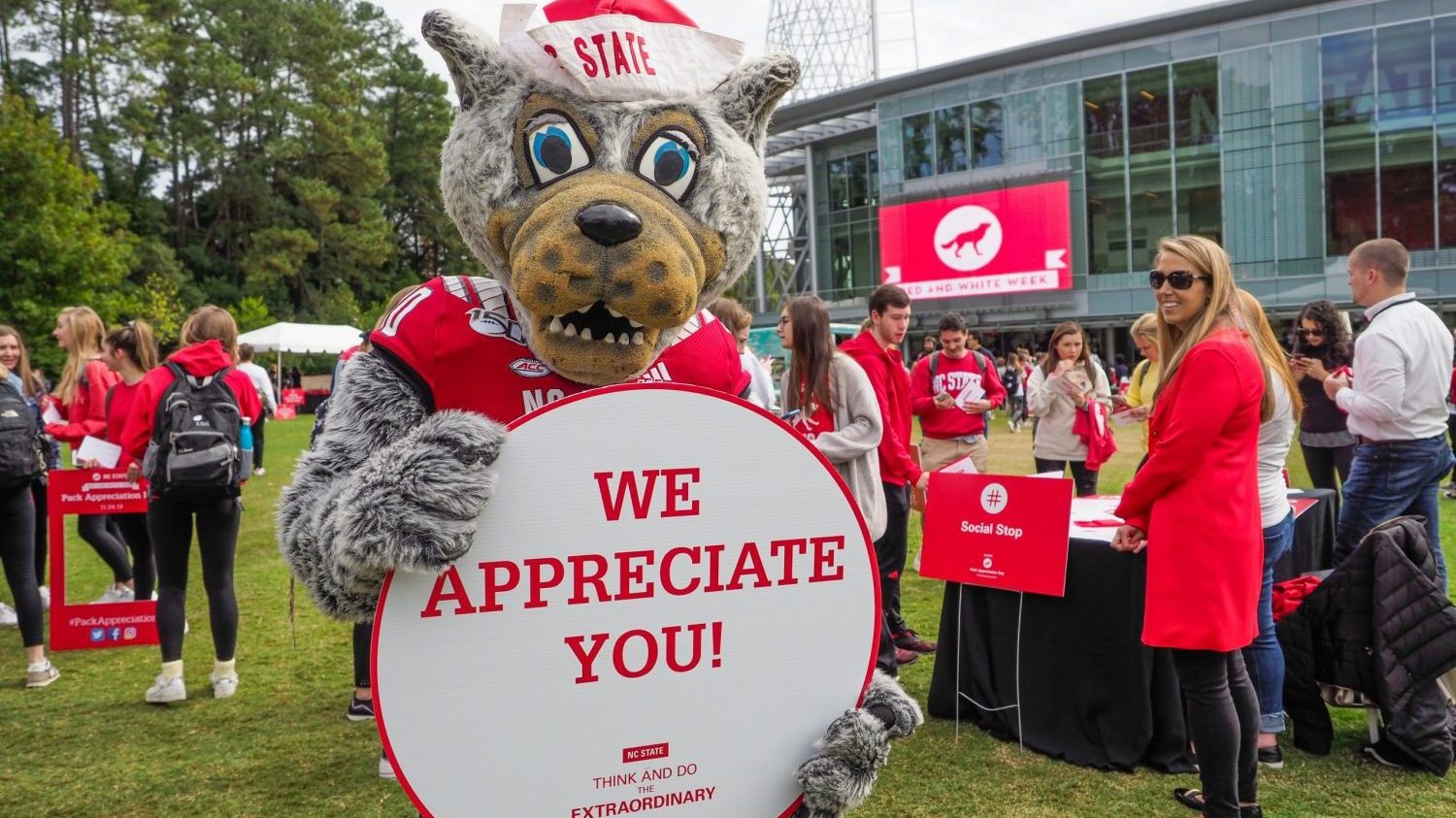 Wolfie mascot holding sign that says "We appreciate you"