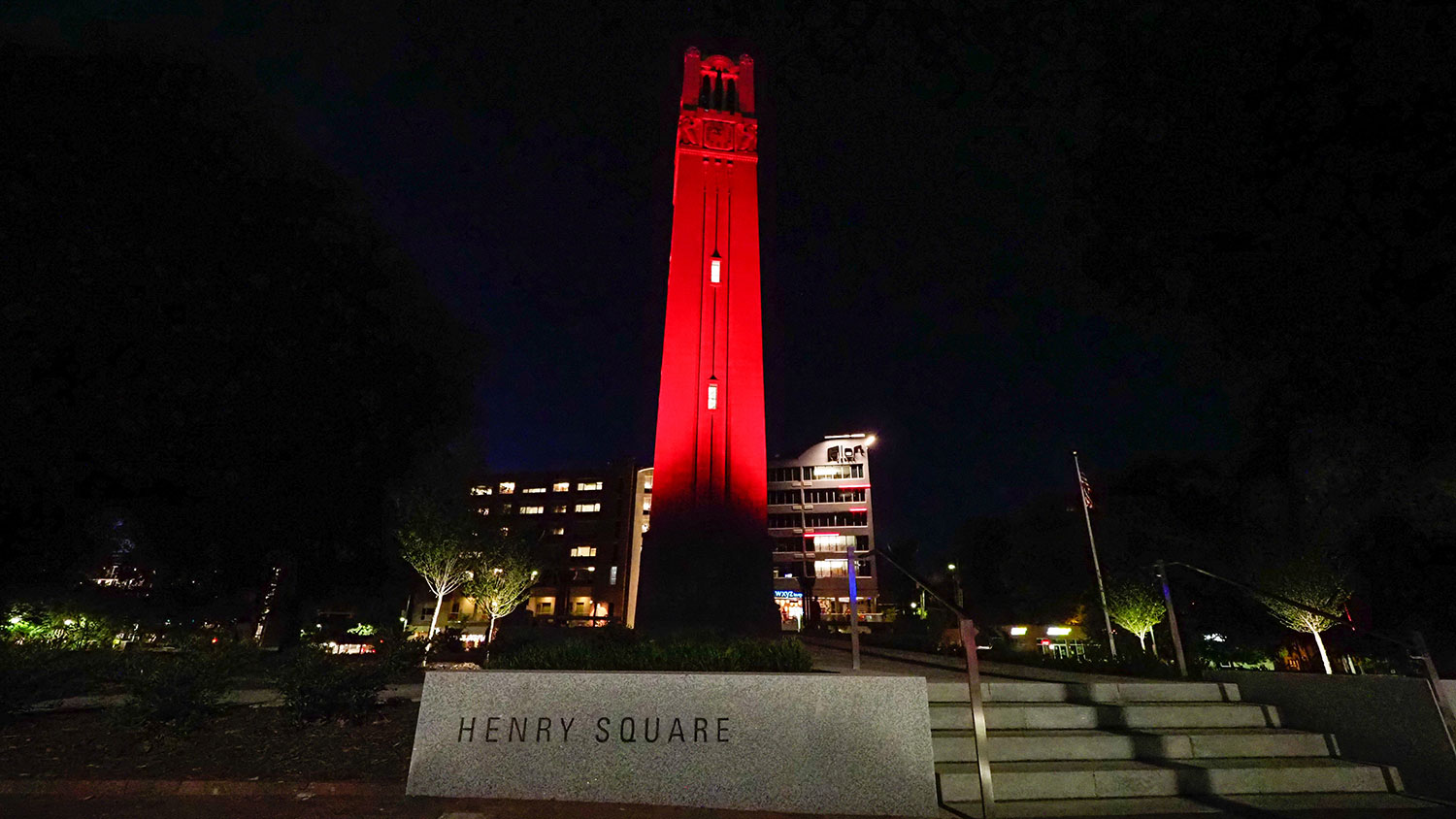 Photo of the Belltower lit up in red