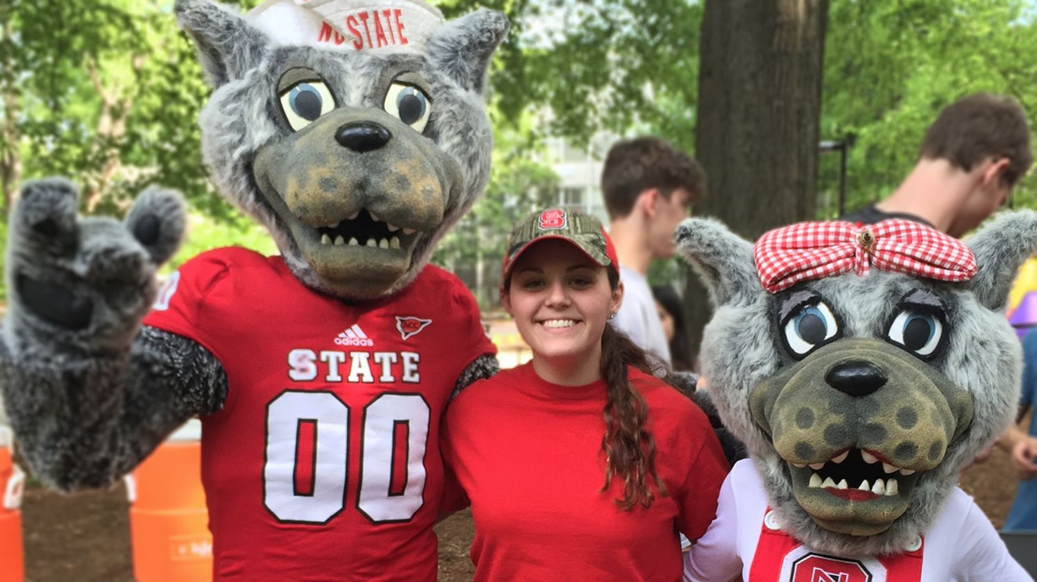 Brittany Wall with Mr. and Mrs. Wuf (NC State mascots)