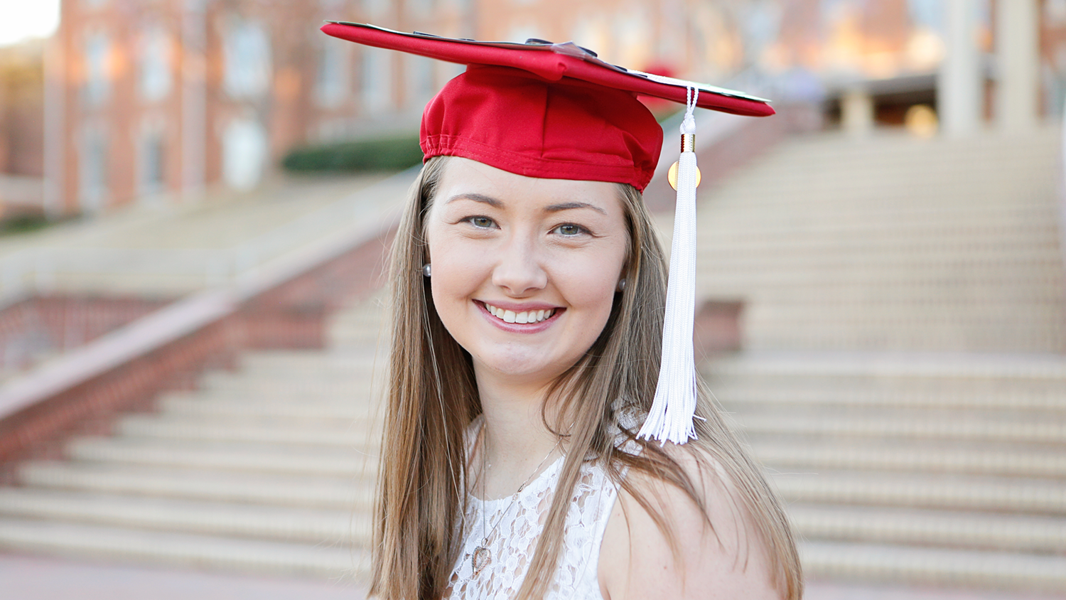 Lisa O'Quinn in a red graduation cap