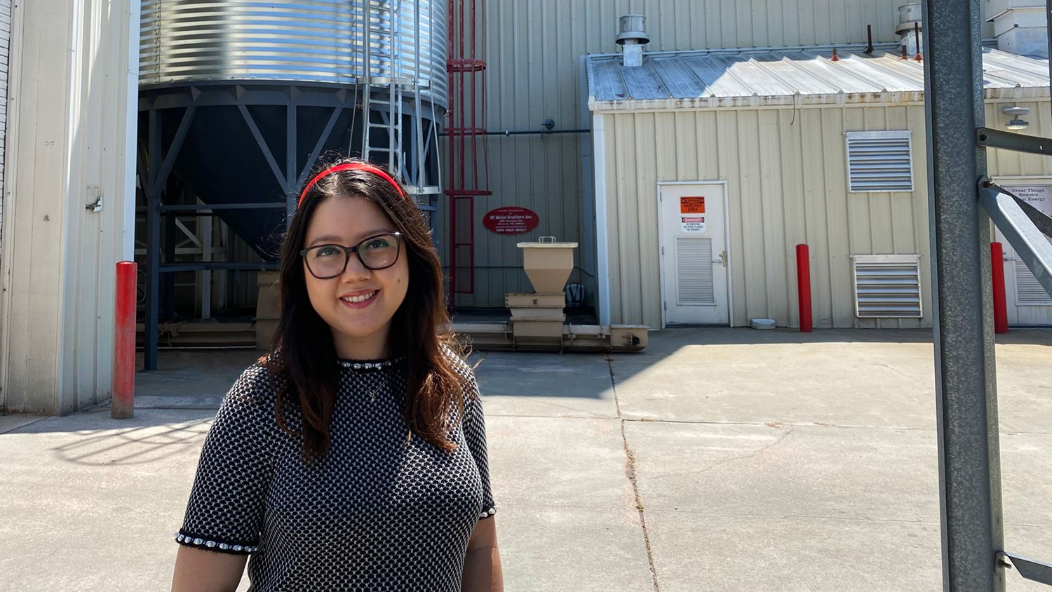 Andrea Rubio in front of the NC State Feed Mill Education Unit