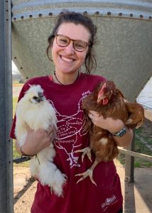 Mary Gray Davis holding two chickens