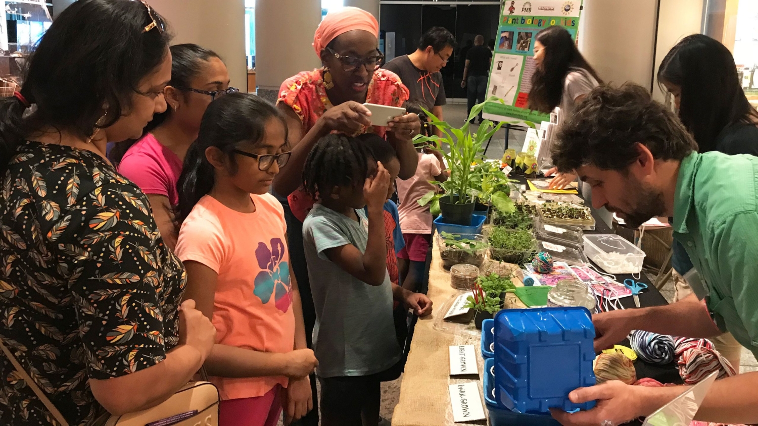 Families take part in a pre-pandemic Plant Biology for Kids event.