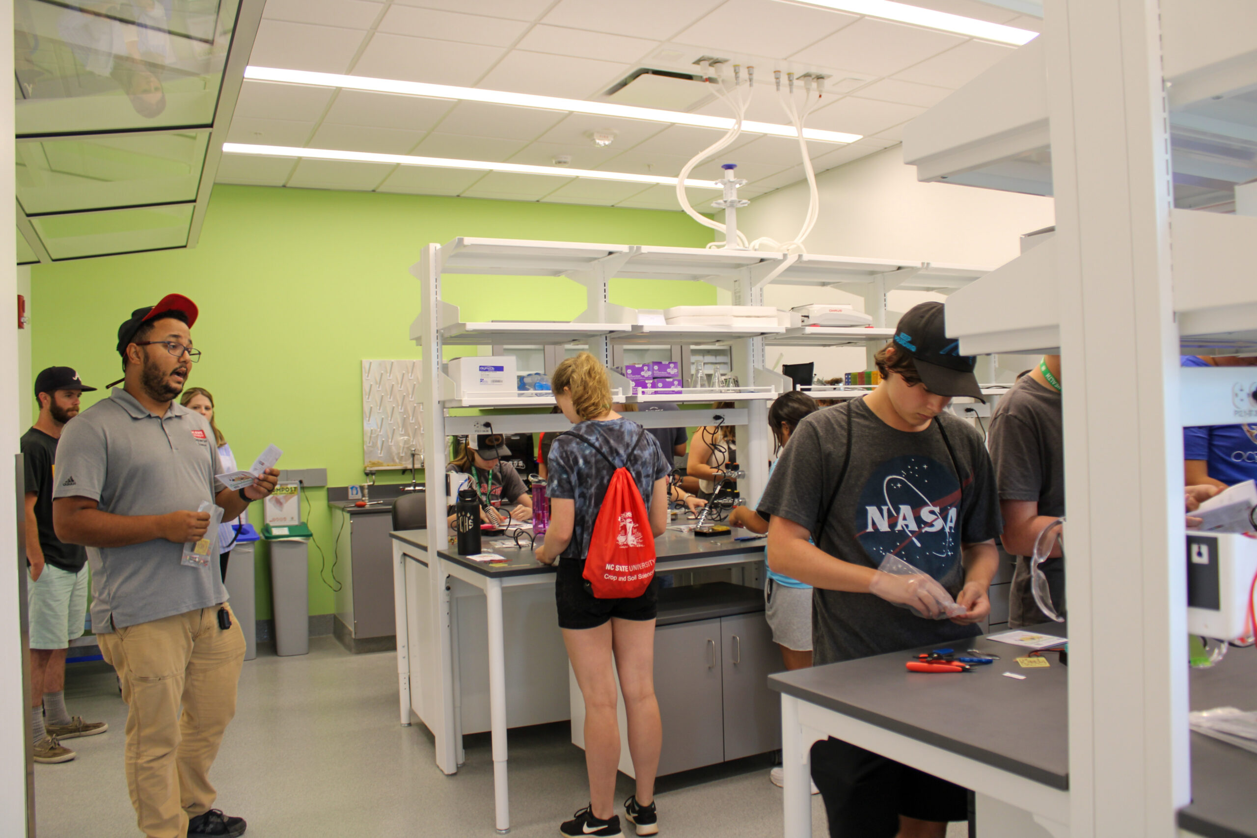 High school students from the Horticultural Science Summer Institute learn to make soil sensors in the N.C. PSI Demo Lab.