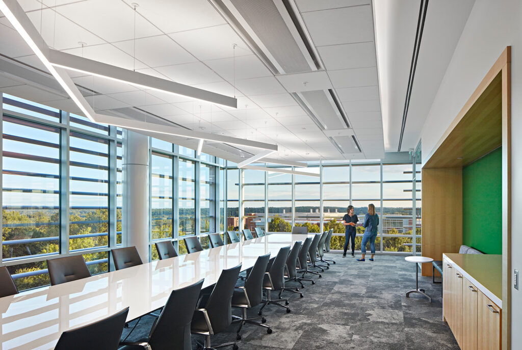 Our beautiful, high-tech boardroom provides sweeping views of Centennial Campus and downtown Raleigh. The boardroom is equipped with a large flat screen TV to use for presentations. This space can accommodate up to 26 people with a small space for catering or snacks.