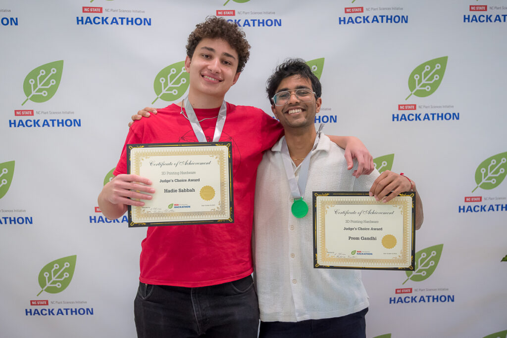 PSI Hackathon participants holding their second place awards