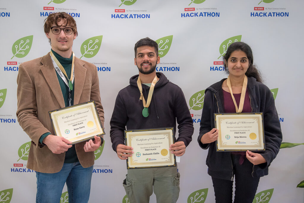 PSI Hackathon students holding their first place awards