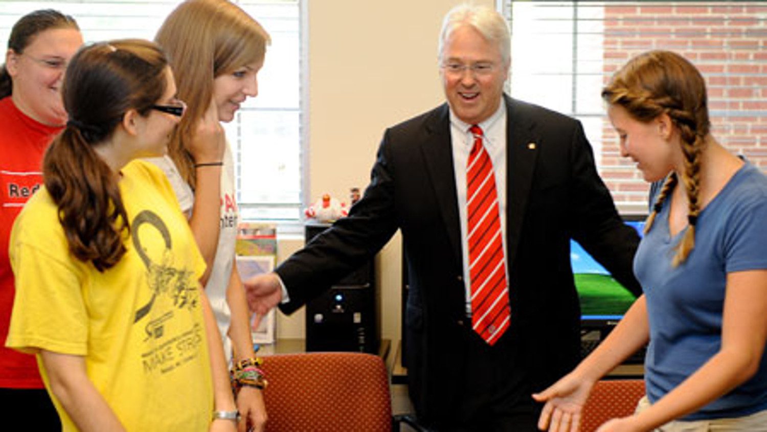 Chancellor Randy Woodson and students involved in VetPAC program