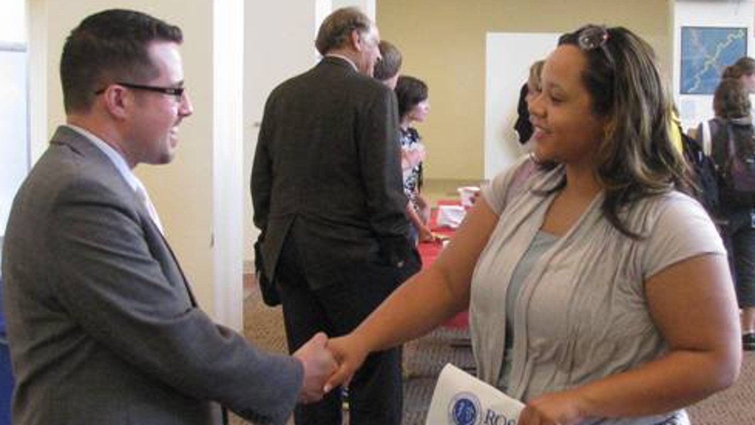 After the VetPAC seminar, Sean Powers, Ross admissions director, meets a CALS pre-vet student at the Riddick hearth reception.