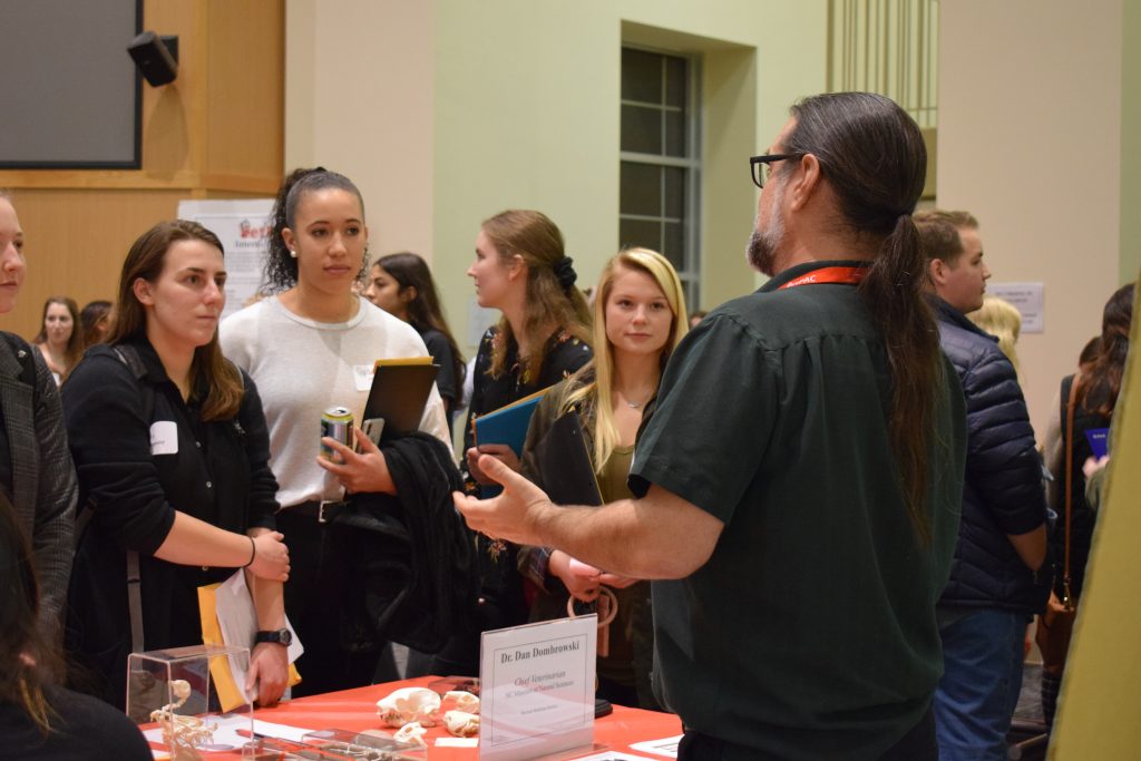 Dr. Dan Dombrowksi speaking to students at a networking event