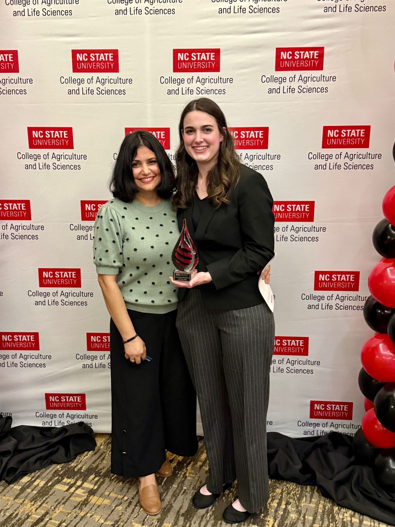 Dr.Shweta Trivedi with Hannah Jewett, 2024–25 VetPAC Intern, standing together at the 2025 CALS Celebration of Excellence awards ceremony.