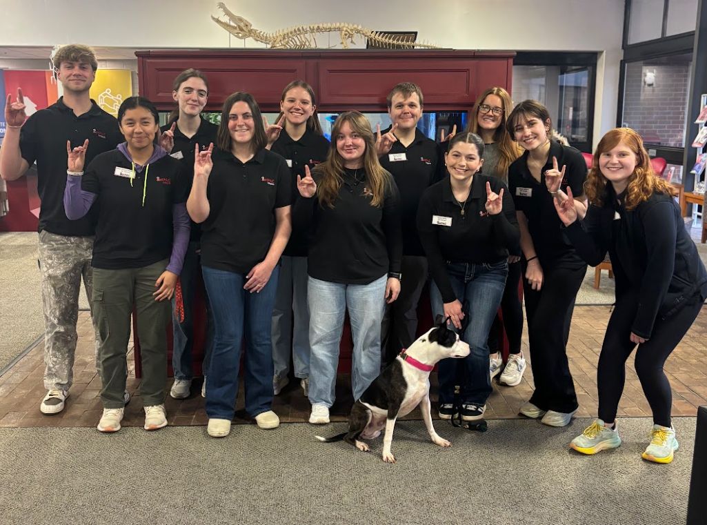 VetPAC interns posing with a dog