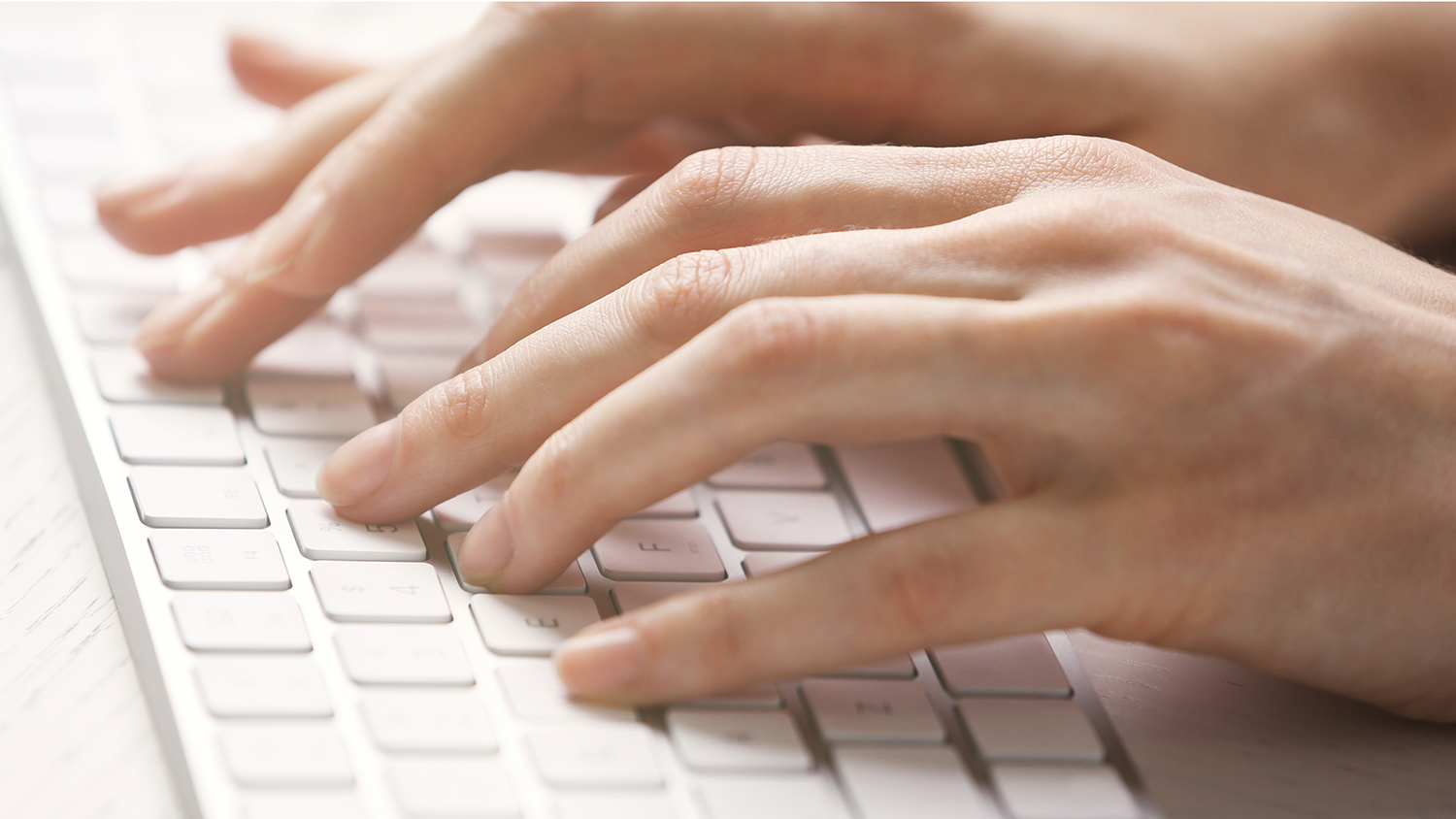 fingers on a computer keyboard