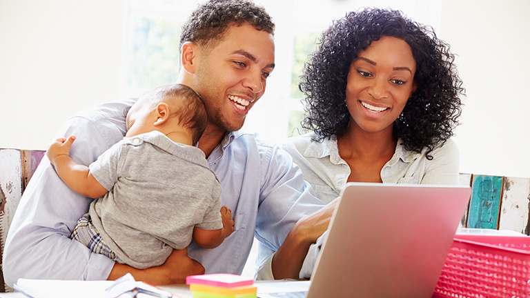 Parents With Baby Working on Social Media