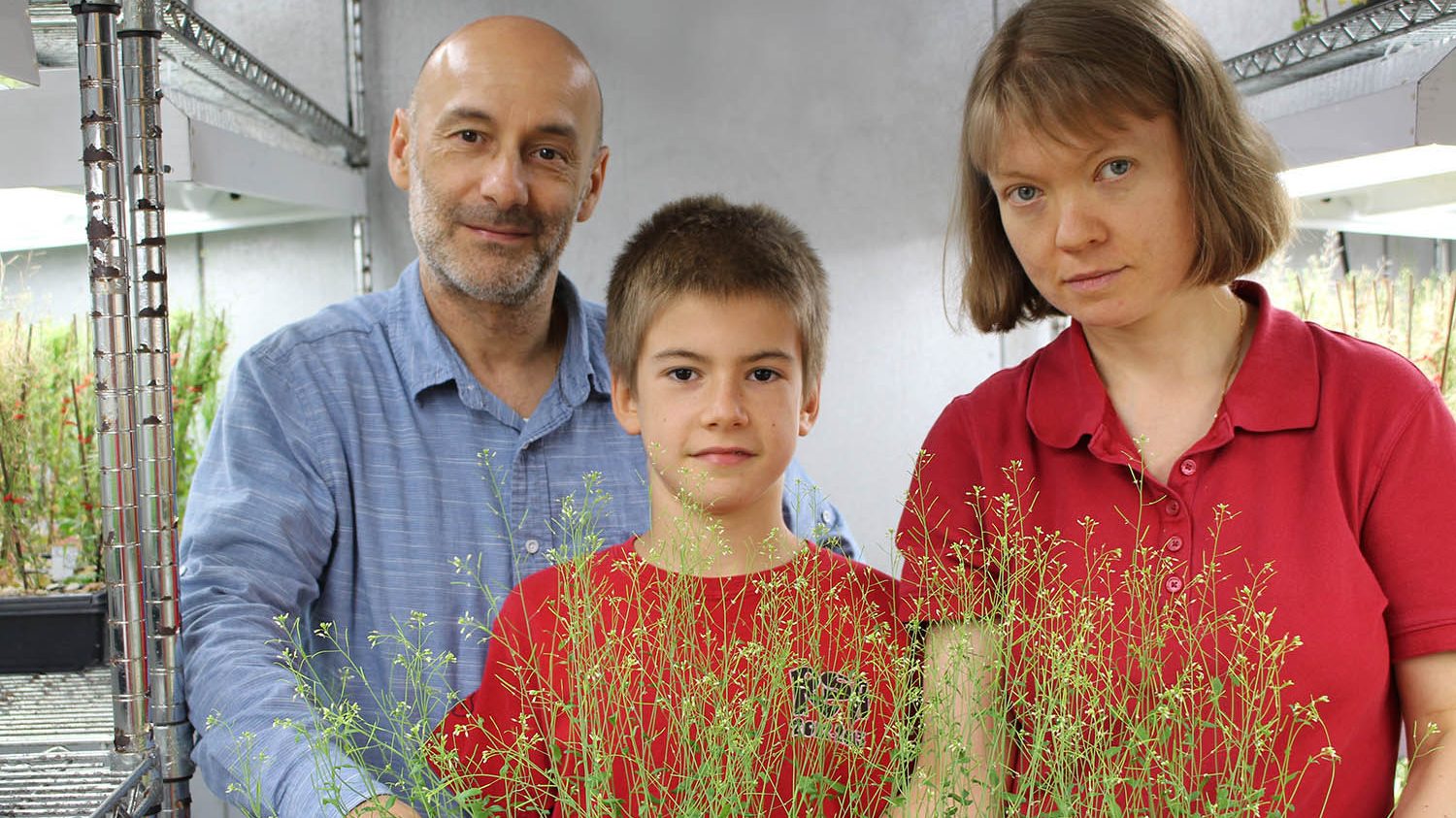 Antonio Alonso-Stepanov with his parents in their growth chamber at NC State.