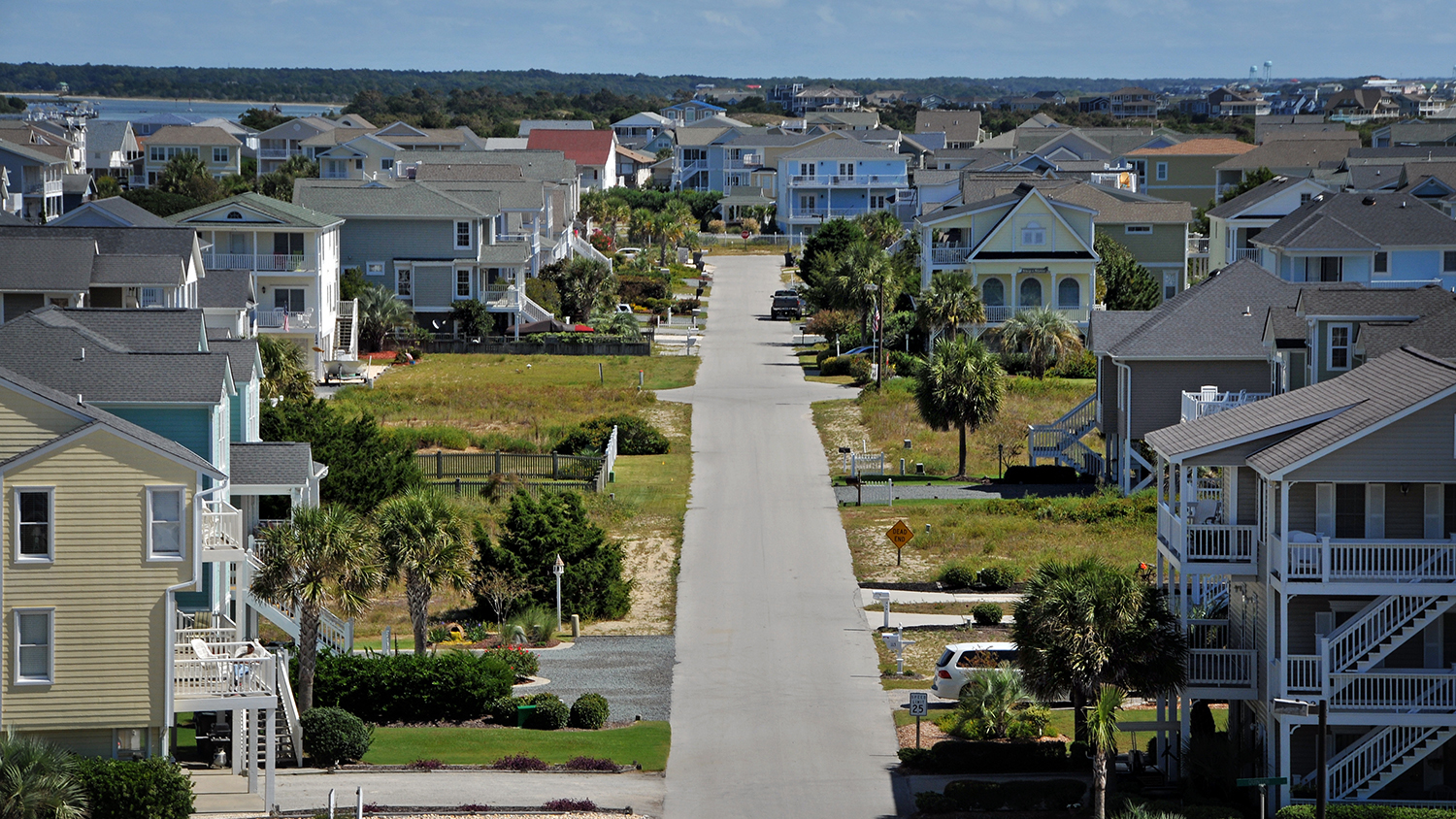 Aerial view of cottages and beach homes at Holden Beach