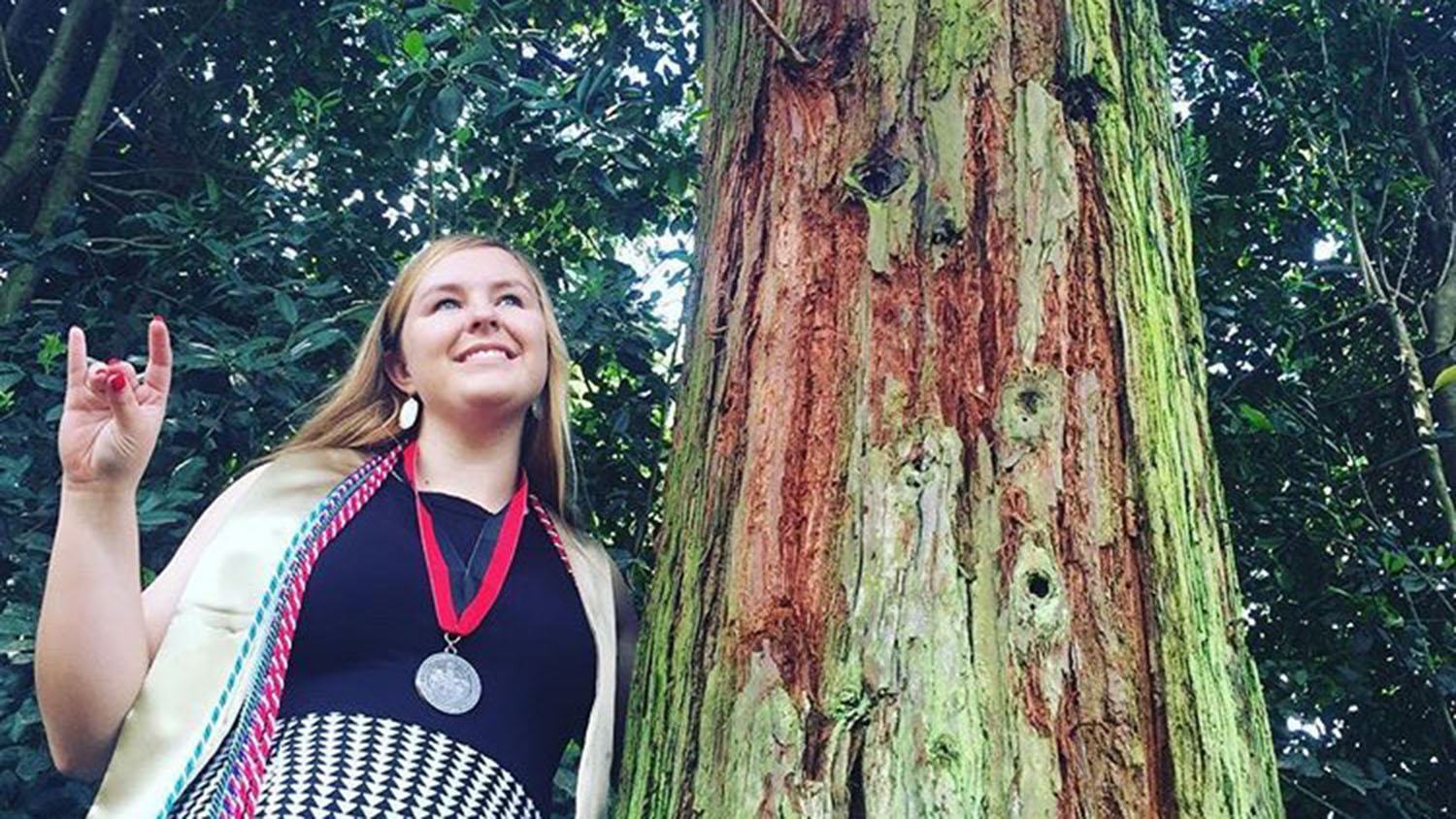 Britanny Bell poses with tree