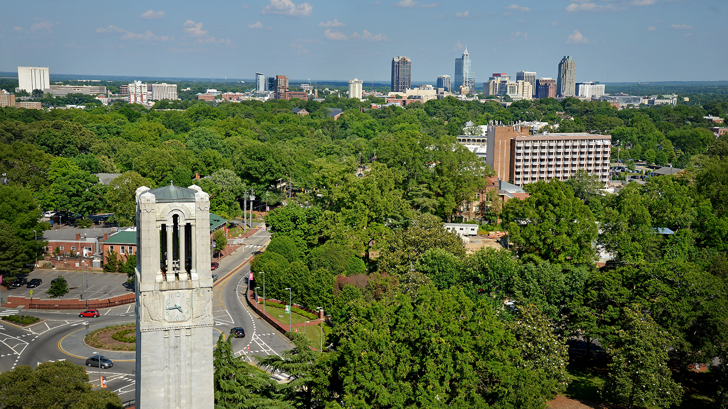 Aerial view of Belltower and downtown Raleigh to the east of campus.