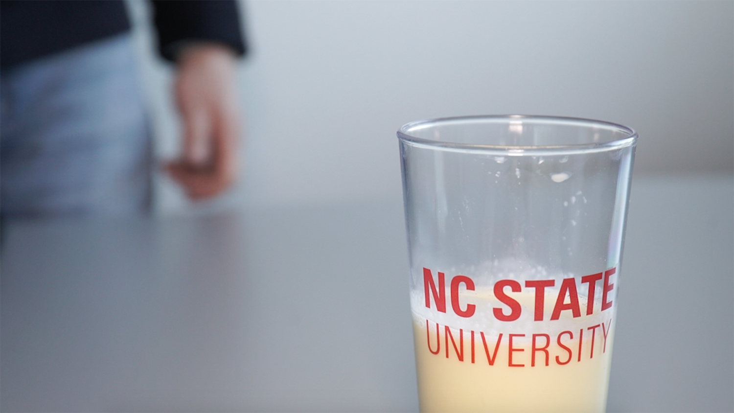 eggnog in an NC State branded pint glass