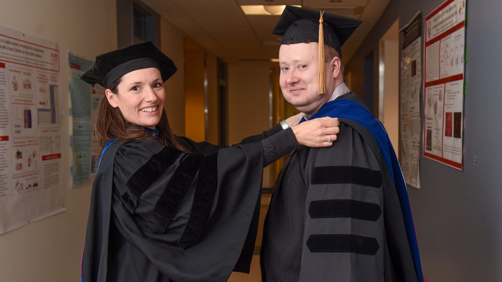 O'Dell and Meilleur prepare for Dec. 15 commencement exercises. 