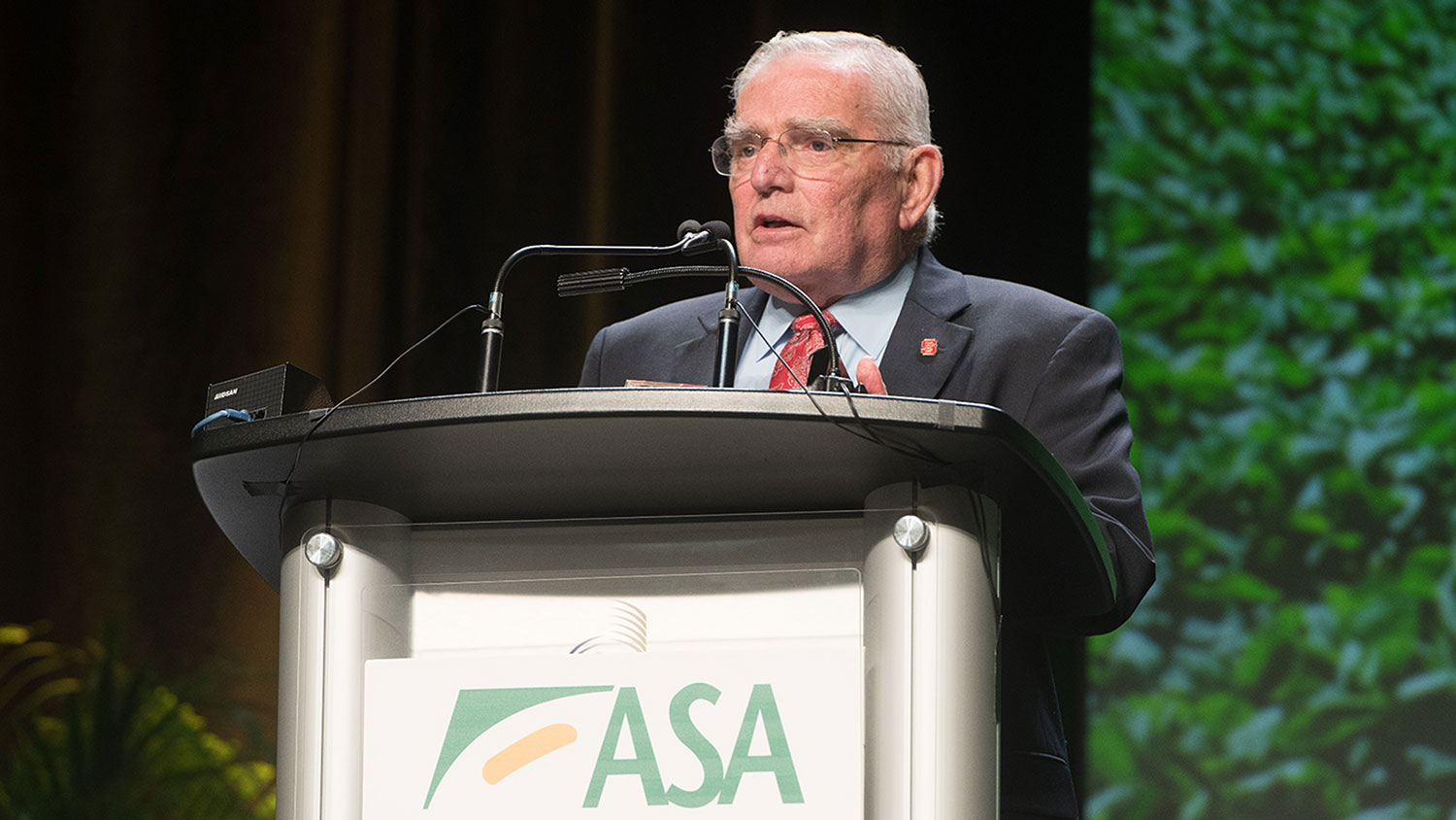 Man at an podium with ASA sign