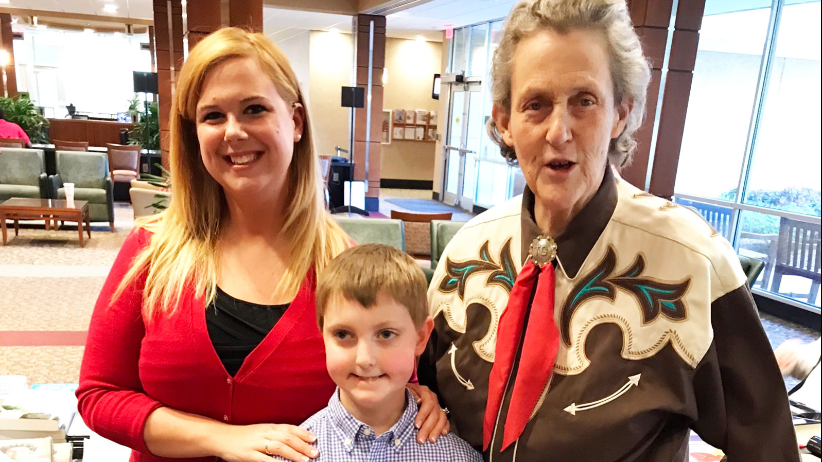 Danielle Pennington and her son Jacob with Temple Grandin.