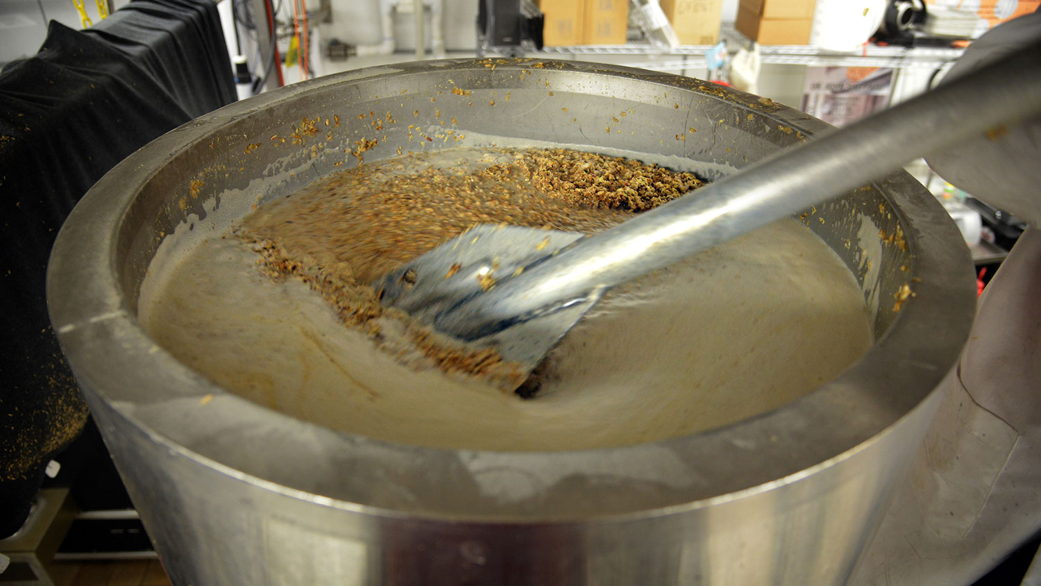 Malt is stirred for a beer production run in a Schaub Hall lab.