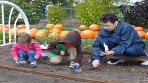 Youth learning about gardening through extension programs.