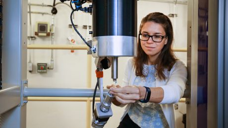 CALS Ph.D. student Gabriela Schroder works on a neutron machine at ORNL on her biochemistry research.