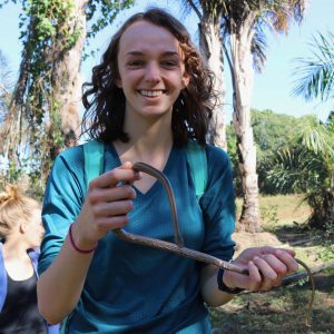 Photo of woman holding a small snake