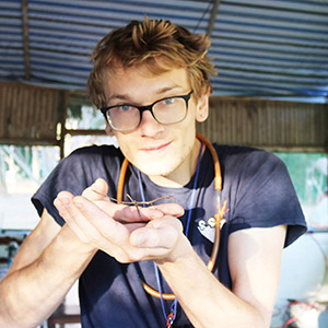 Man holding an insect