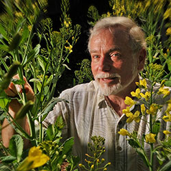 Fred Gould surrounded by plants