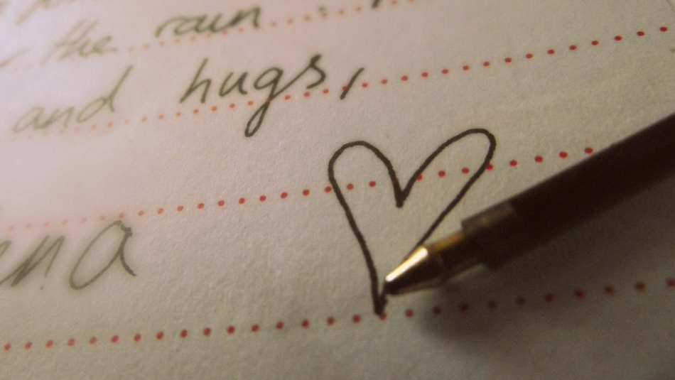 handwritten word "hugs" and a heart