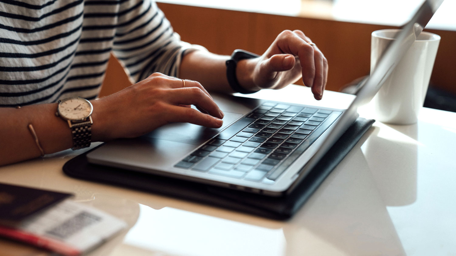 hands on a laptop