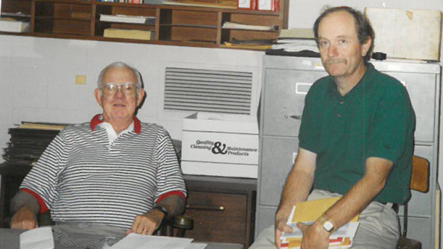 Two men seated in an office