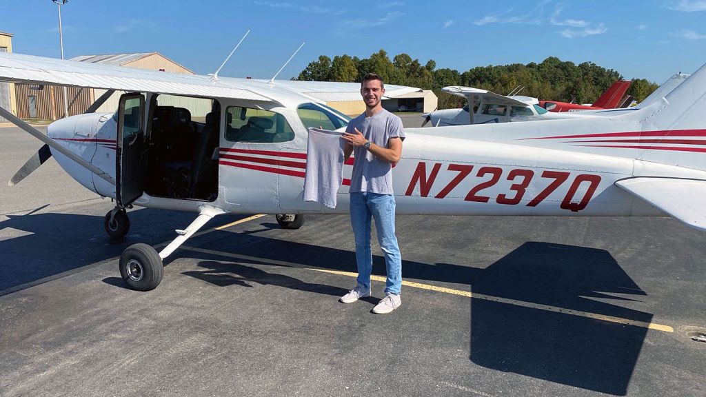 Andrew Berley with small-engine plane