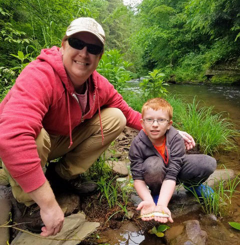 A man and his young son fishing