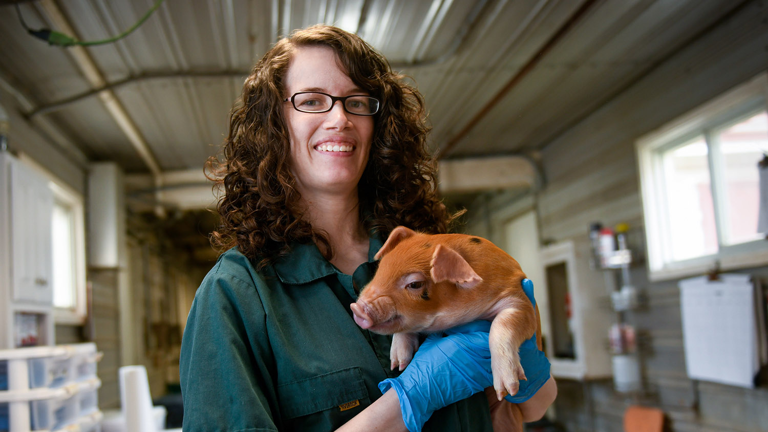 Woman holding a pig
