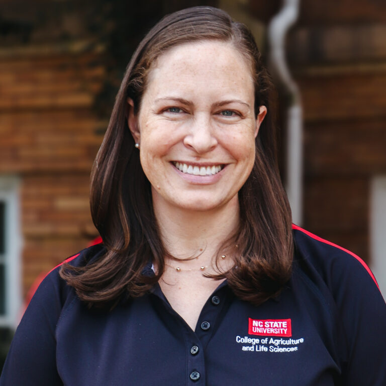 Woman in black shirt smiling