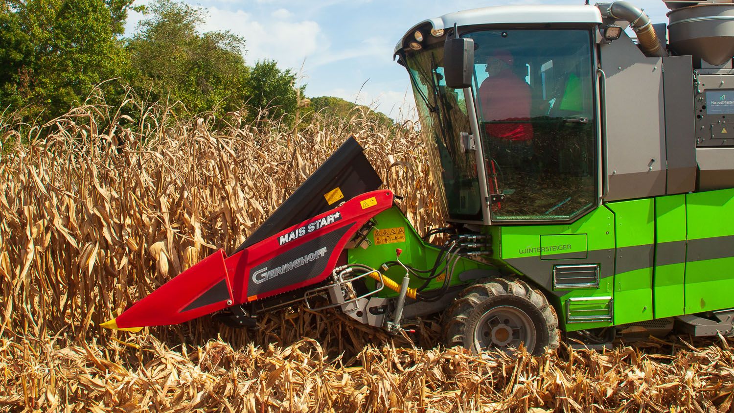 Combine in corn field