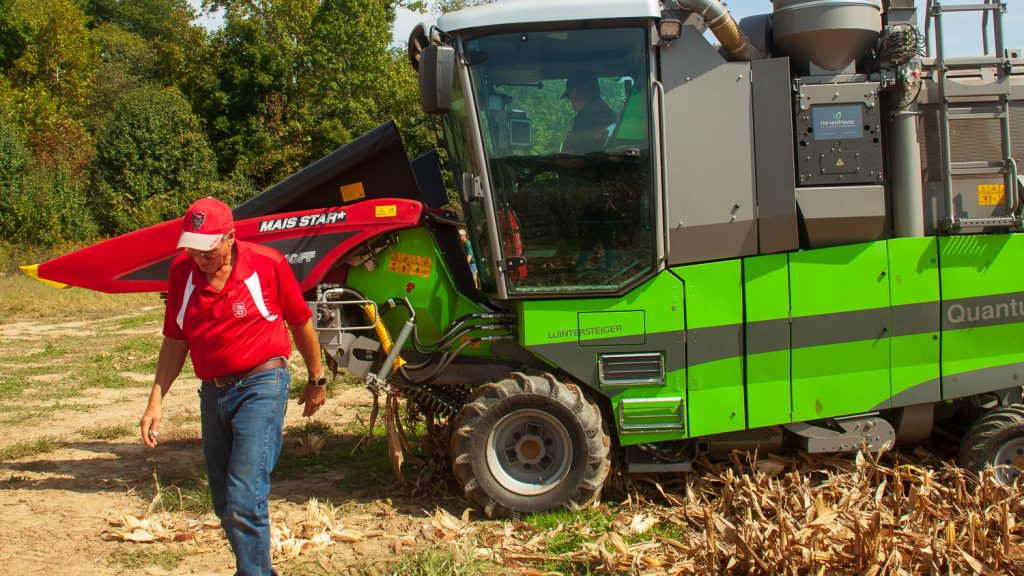 Scientist walking away from a combine