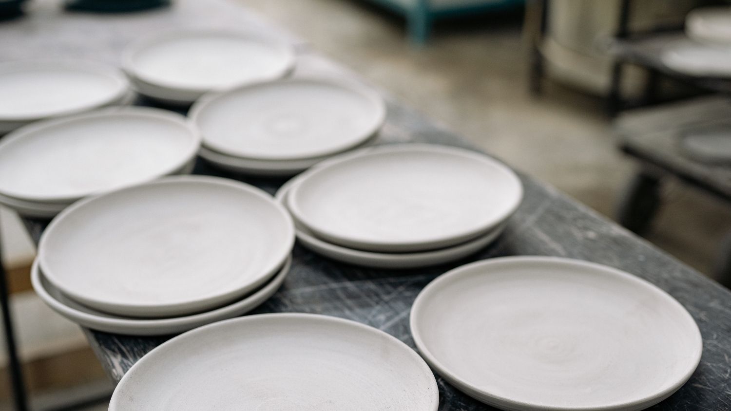 White plates stacked on a table