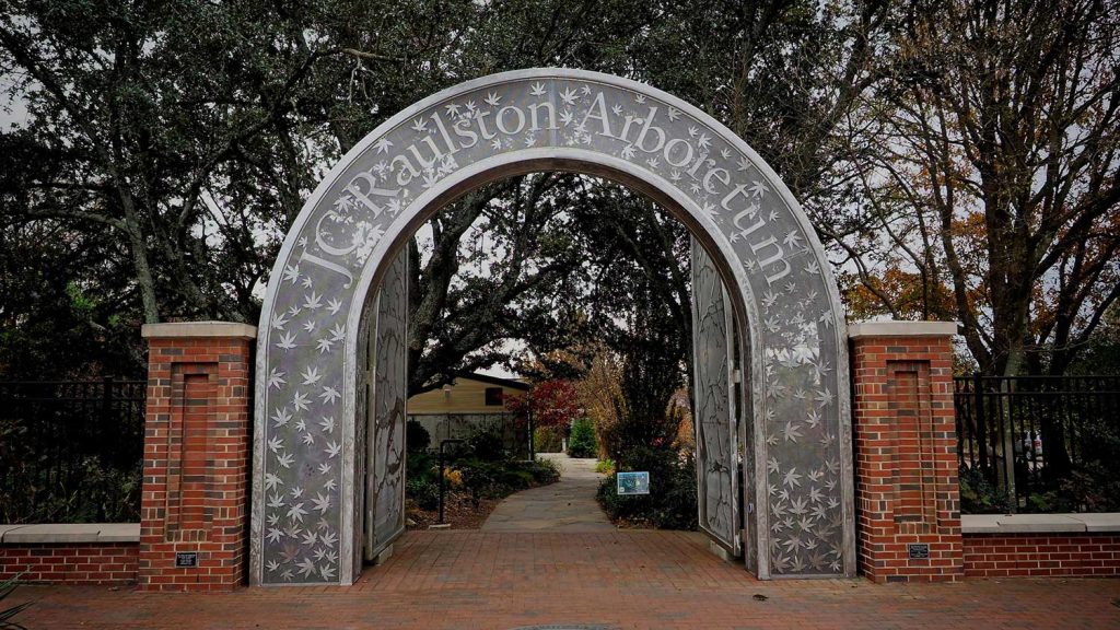 The doors at JC Raulston Arboretum are designed with leaves that fall for guests to pass under.