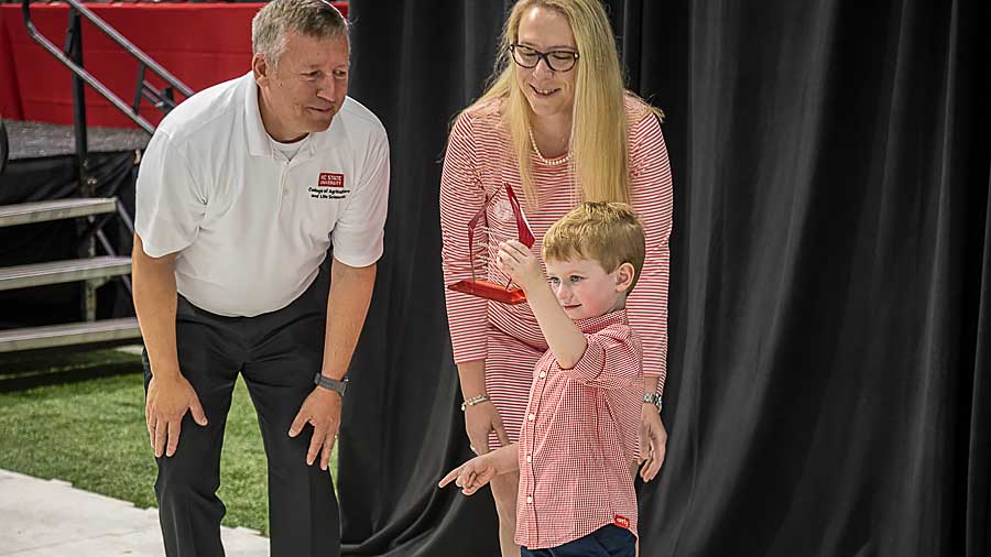 Lendy Johnson with her son and CALS Dean Richard Linton