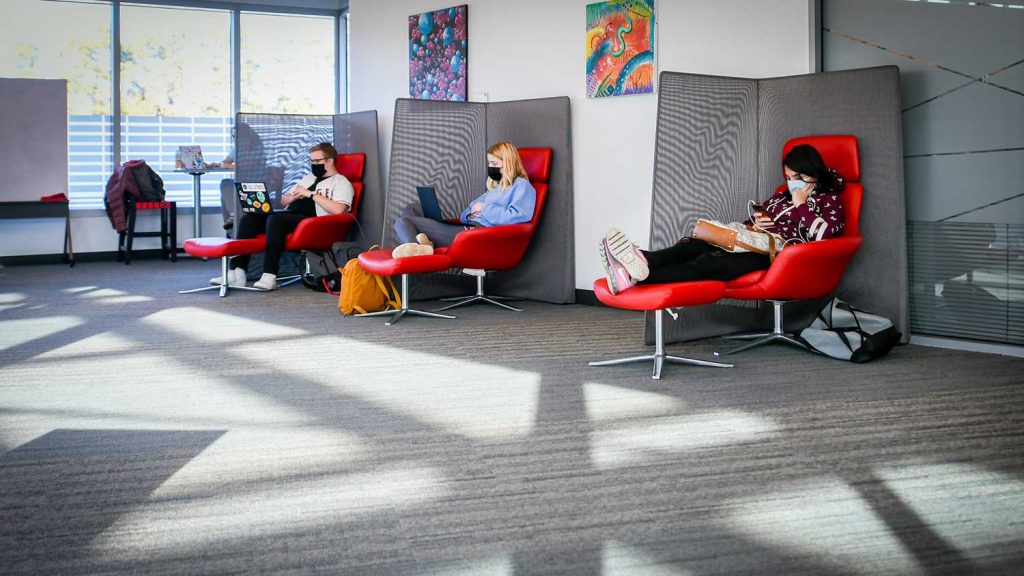 Students are masked up and studying in Talley at personal lounge chairs.